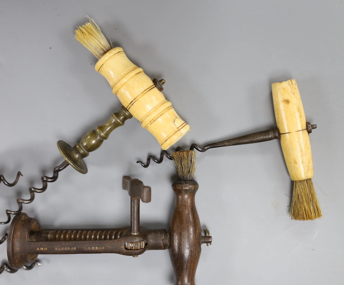 Three bone handled corkscrews and two other corkscrews including one by Lund, Cornhill